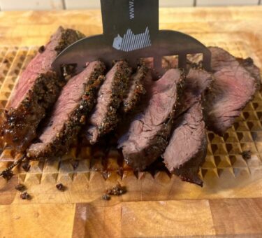 Meat claw with carved rare roast beef