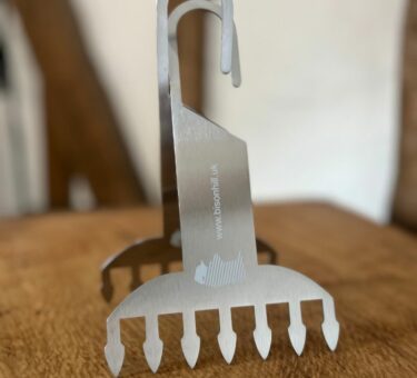 Standing meat claw on a butcher's block