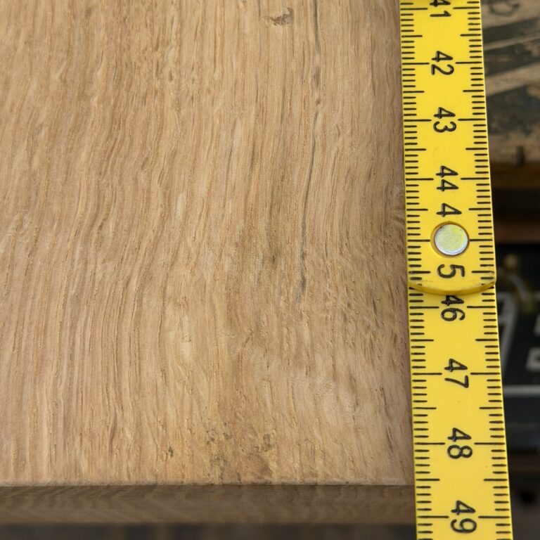 A yellow rule measuring the 48.5cm length of a large solid oak chopping board surface.